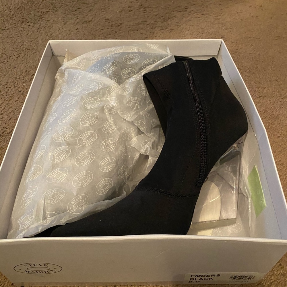 Steve Madden bootie with clear wedge heel.